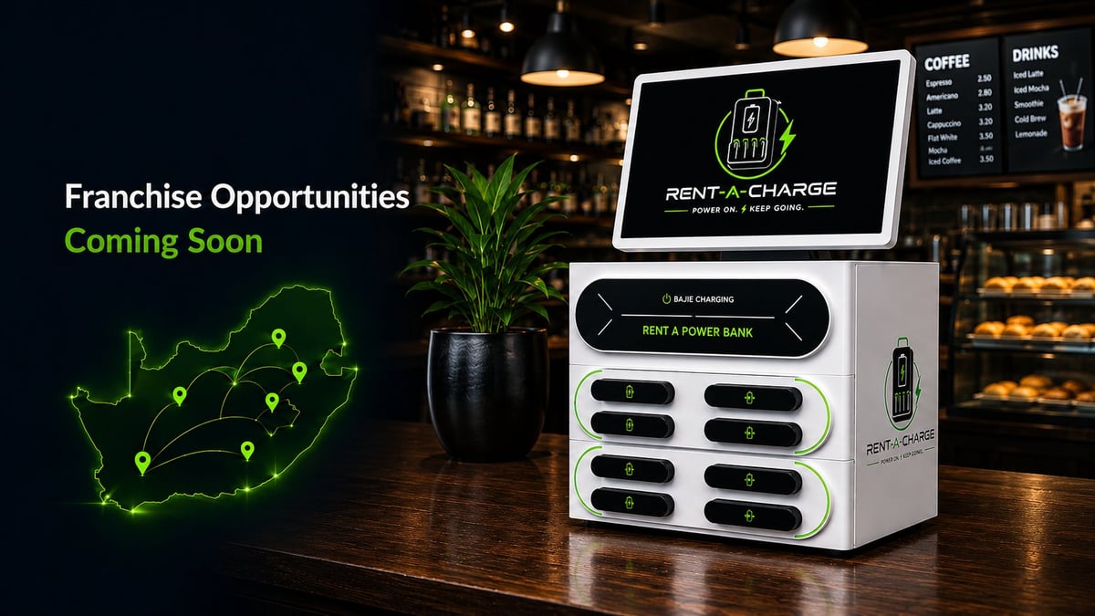Rent-A-Charge EV charging station displayed in a modern cafe with South Africa map showing franchise locations and Coming Soon text